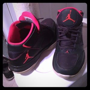 pink, black ,and white Jordans hightops