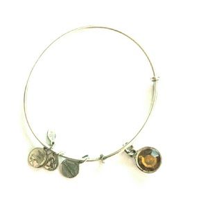 Alex and Ani bracelet with topaz colored gem