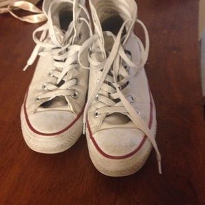Worn white and red converse