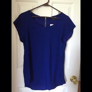 Blue Express shirt with gold zipper in back
