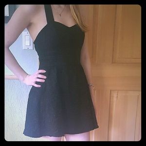 Short black halter dress. Great for a night out!