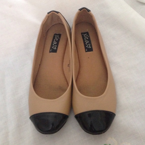 Tan and black flats