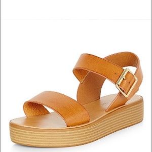ISO Tan platform sandals.