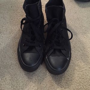 Solid black Converse high tops