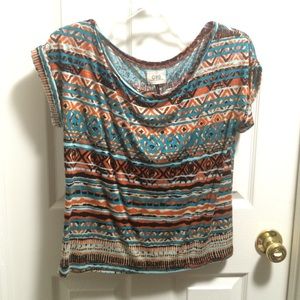 orange, brown, and teal patterned shirt