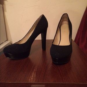 Nine West black sequins pumps.