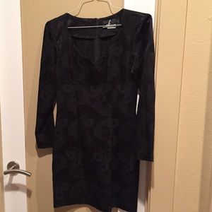 Black cocktail dress with scalloped bodice