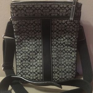 Black and white signature Coach cross body