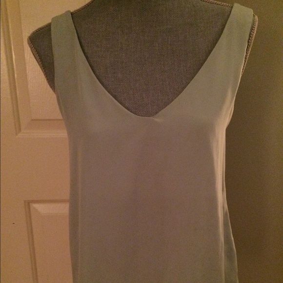Mint green top with back bow detail. Size small