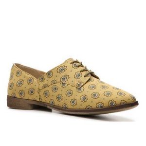 Lightly worn yellow oxfords