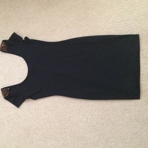 Little black dress with gold shoulder spikes