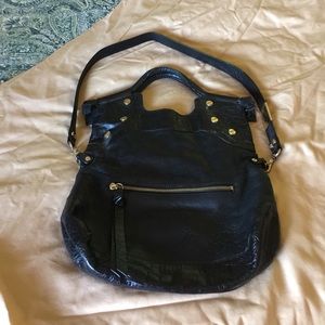 Foley and Corinna black leather satchel.