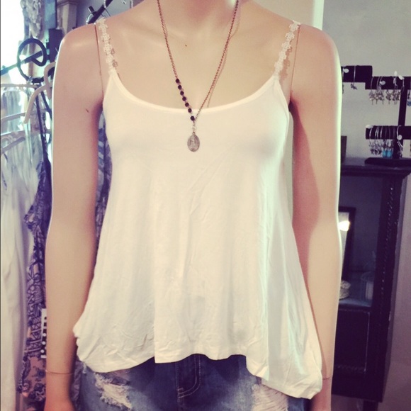 1 white tank, 2white bralettes 1 black bralette