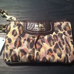 REAL Coach wristlet; tag intact never used