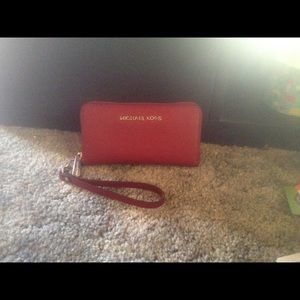 Red Michael Kors wristlet.