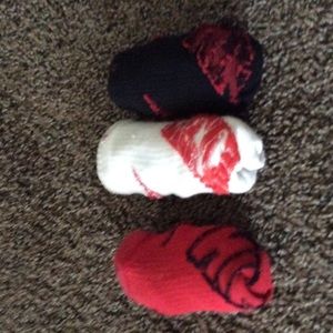 Red,black, and white nike socks.