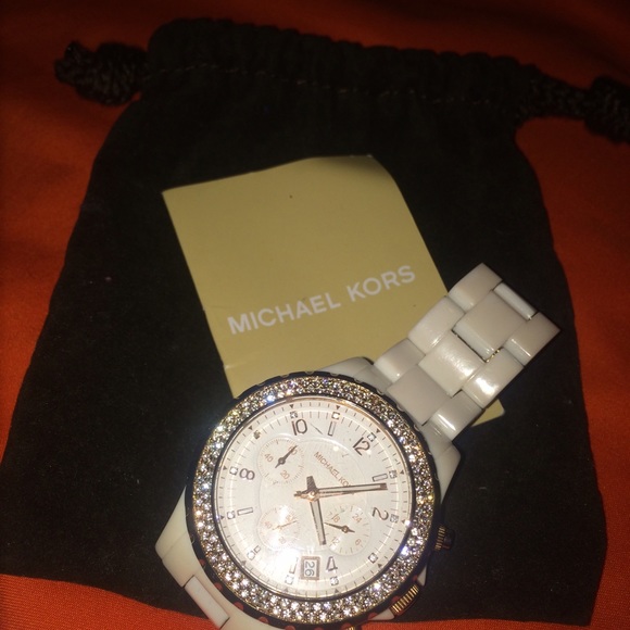 Authentic Michael Kors rose gold rimmed watch