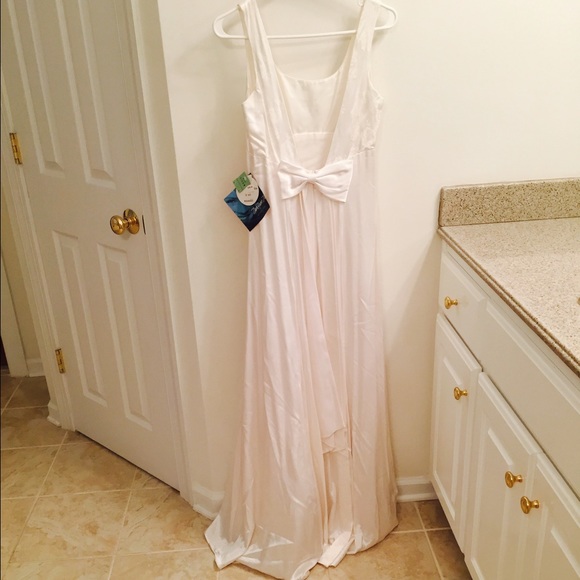 White evening dress with bow design by Niki Livas