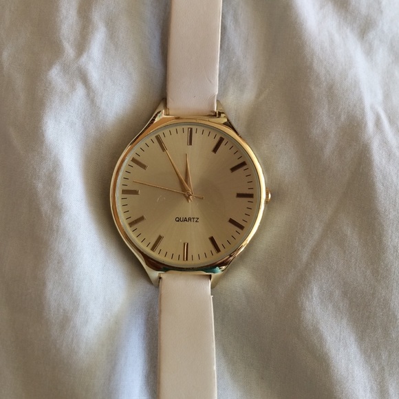 Gold watch with leather white band!
