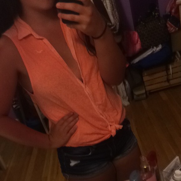 Neon orange sleeveless button-up