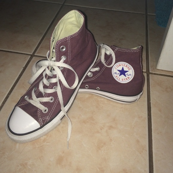 Purple high top Chuck Taylors