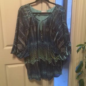 Multi colored dressy top in blues.