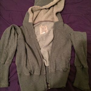 Sweater with fuzzy hoodie.