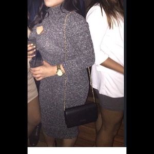 Grey form-fitting dress with opening at chest