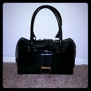 This is a nice big size Ted Baker black purse!