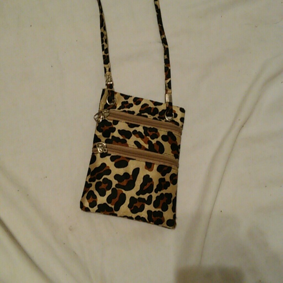 A cross body miniature purse or pouch