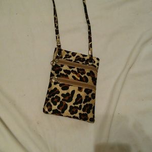 A cross body miniature purse or pouch