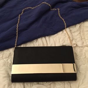 Aldo black and gold clutch purse