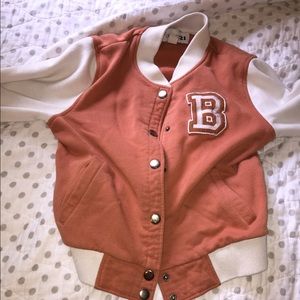 Orange jock jacket with off white sleeves