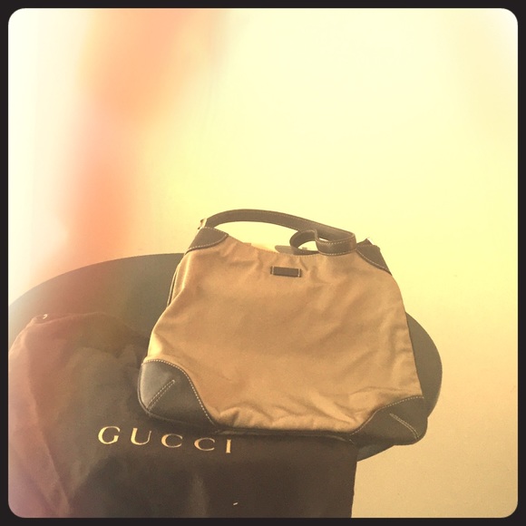 Gorgeous Gucci purse with leather strap. LIKE NEW!