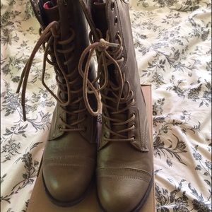 Calf length lace-up boots