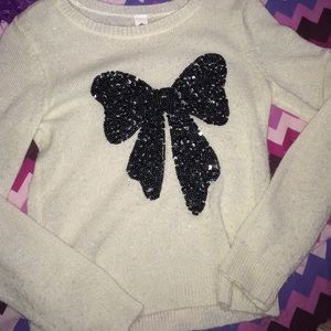 white sweater with black bow