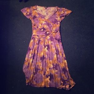 A long purple dress with a brown/gold camo