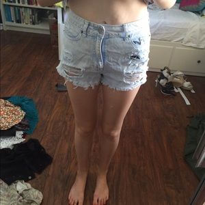 High waisted shredded shorts