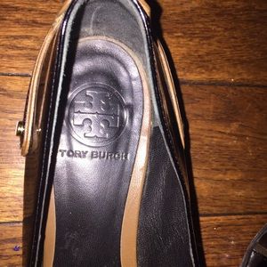 Tory Burch flats with gold tone hardware.