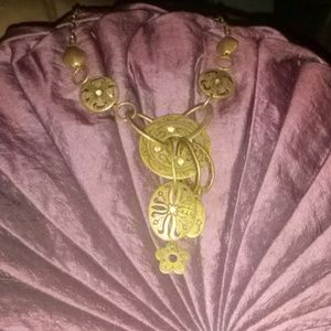 gold colored charm necklace