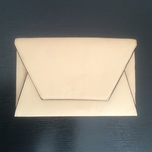 Zara nude clutch with black piping detail!