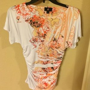 White/orange floral blouse