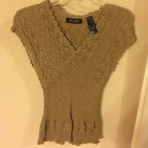 Light brown light sweater.