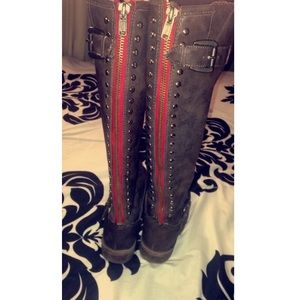 Brown leather boots with red zipper