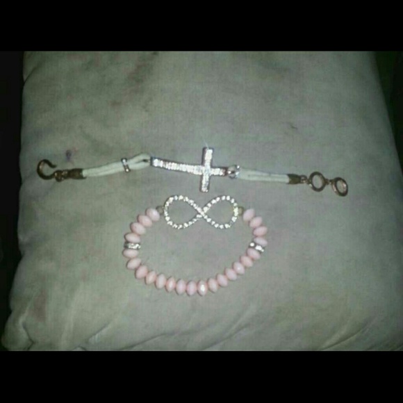 Cross bracelet and infinity sign bracelet.