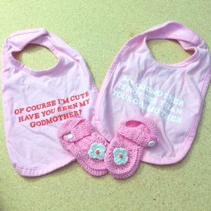 Two bibs and one hand made shoes for baby girl .