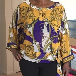 Jennifer Lopez multi-color blouse.