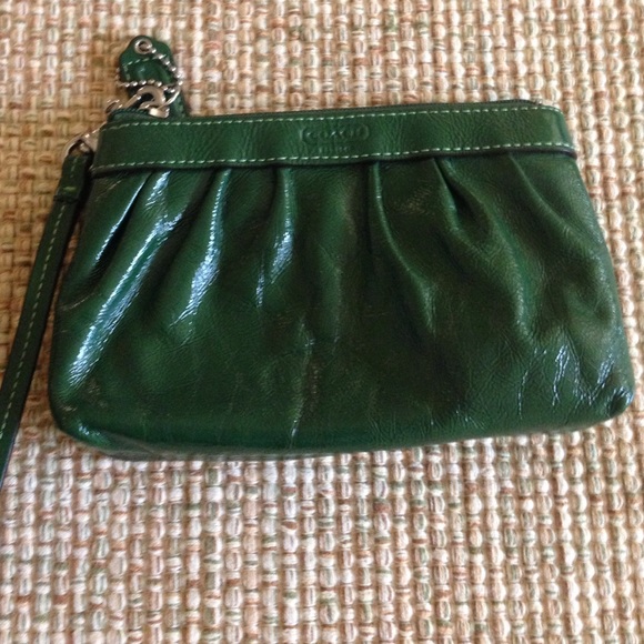 Coach green leather wristlet.