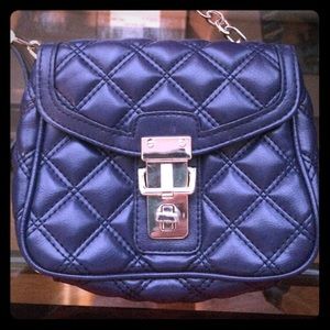 Blue quilted crossbody purse with silver detailing