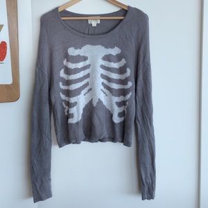 Gray knit sweater with white ribcage design